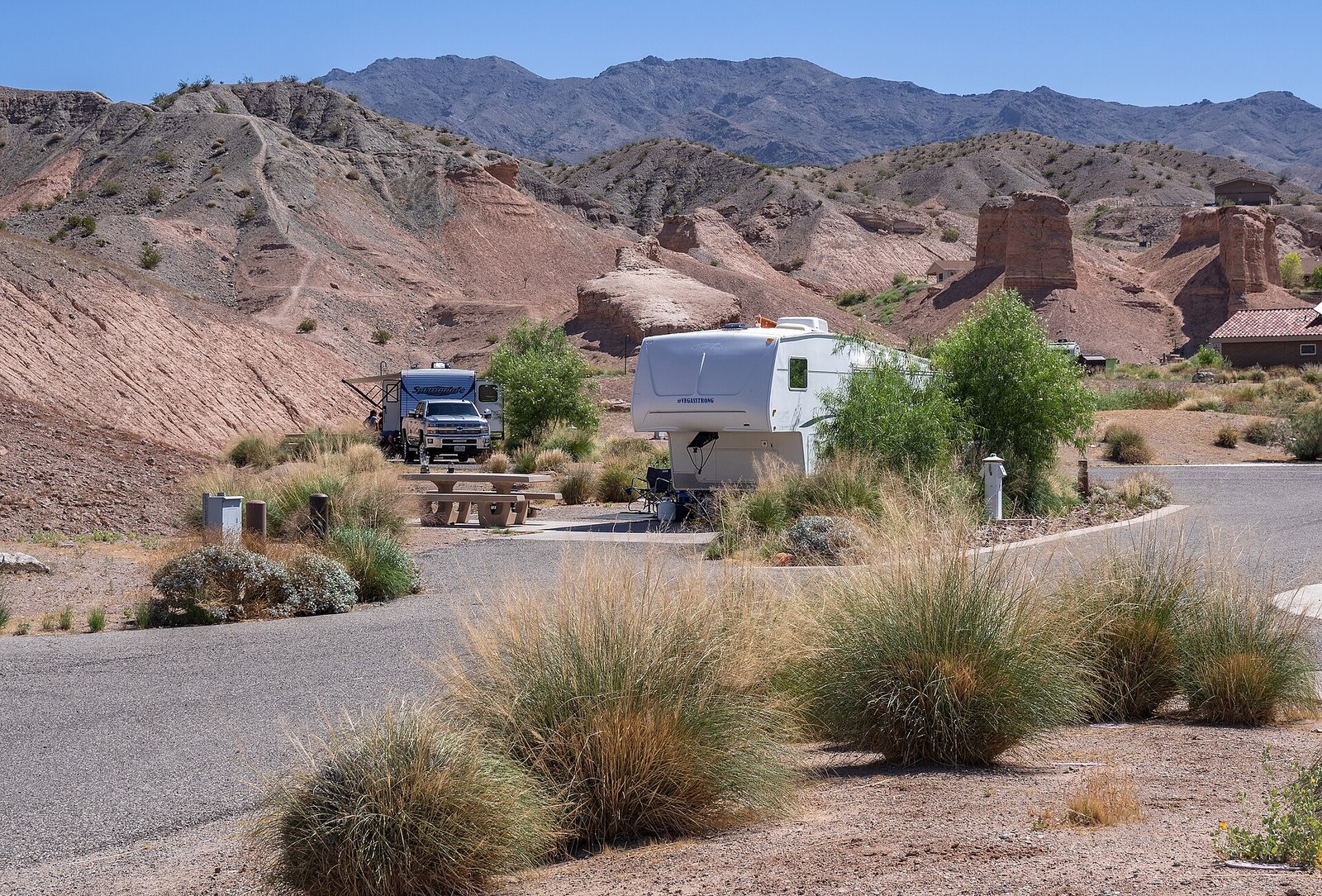 RV sites at a desert campground with mountains in the background